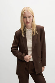 A woman wearing a brown smart basic blazer, front view